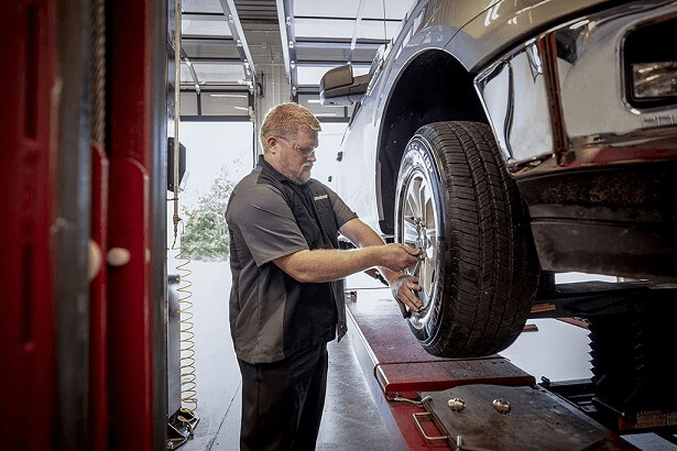 A Meineke technician providing 4 wheel drive repair service