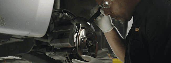 A brake inspection done by a Meineke Technician